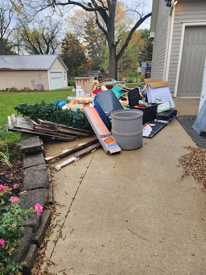 Dumpster being loaded with debris for 30 Yard Dumpster Rental in Carrollton